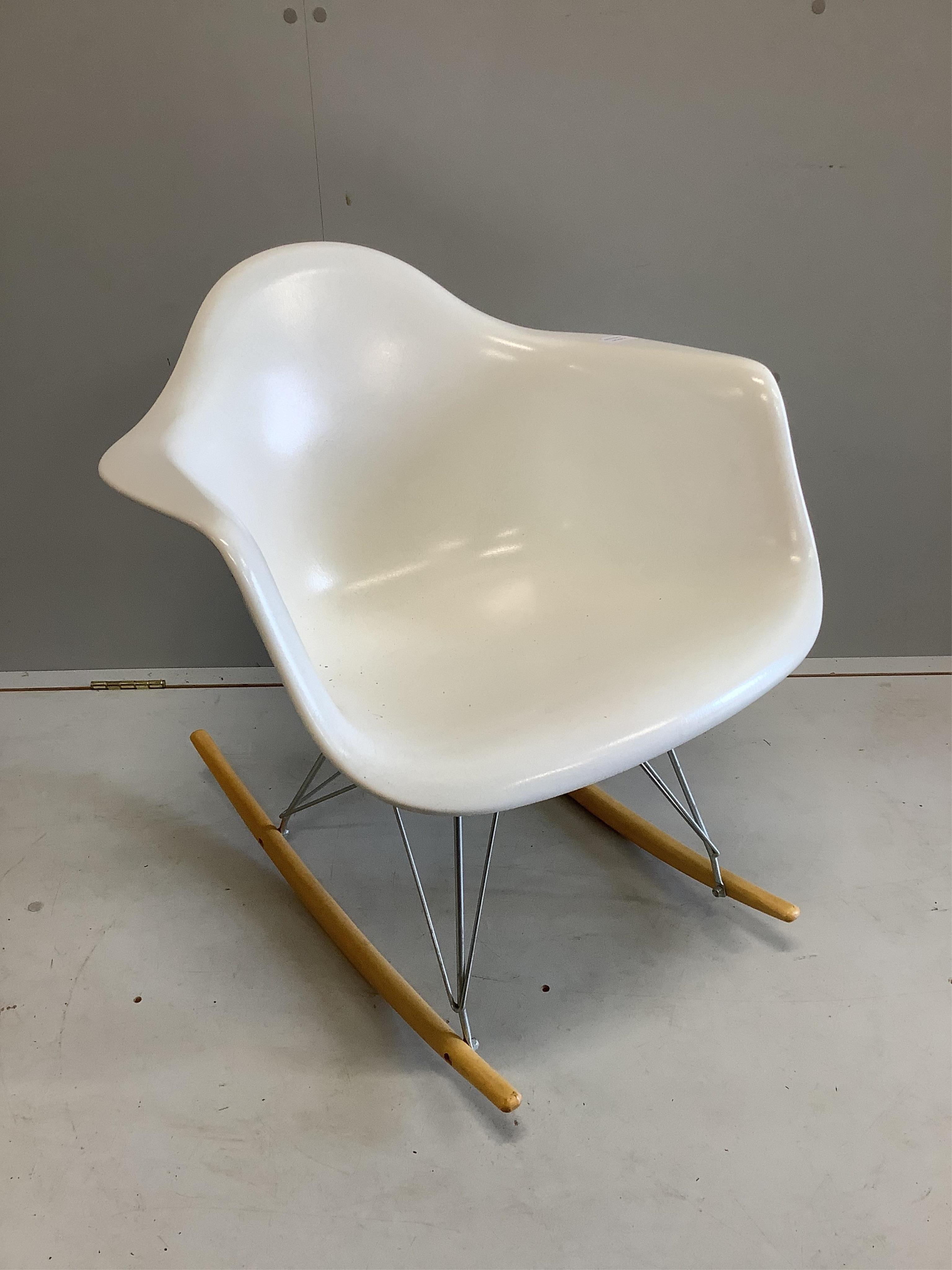 A Vitra Eames rocking chair, purchased from Skandium, width 63cm, depth 68cm, height 67cm